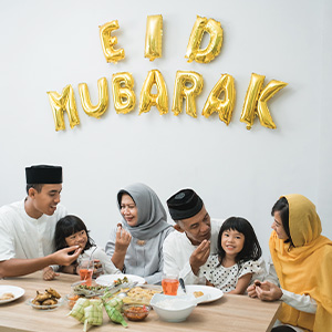 Image of a family of six celebrating and eating food