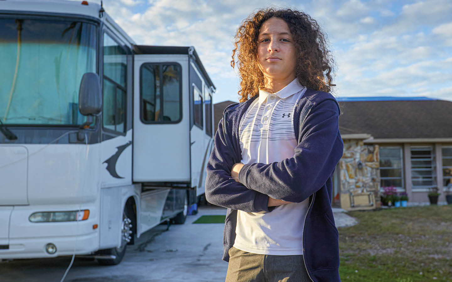 Image of a person standing next to an RV