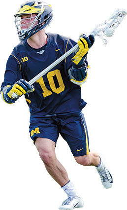 A lacrosse player running with their stick holding the ball