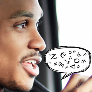 Image of person speaking with speech bubble filled with various letters coming from mouth