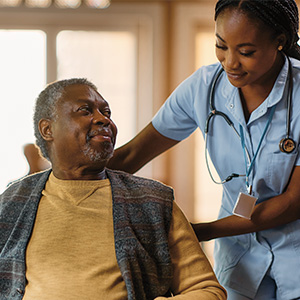 Image of a nurse taking care of a patient in a nursing home